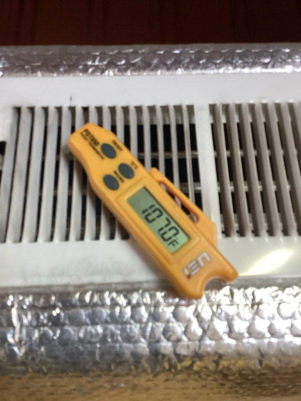 Responded to no heat call after customer returned from trip to find home at 50°F with frozen condenser line. Performed diagnostic testing with digital measurement tool, confirming system is now producing proper airflow at 70°F. Verified thermostat operation and restored heating functionality to normal parameters.