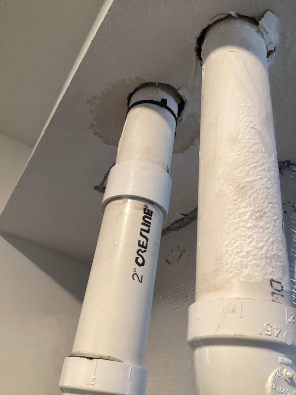 Responded to customer complaint of water dripping noise under master bathroom floor when furnace operates. Inspection revealed water damage in garage ceiling around PVC pipe connections to furnace. Identified condensation forming on cold PVC drain pipes during furnace operation as the source of the leak. Applied proper insulation to exposed PVC pipes to prevent further condensation and water damage.