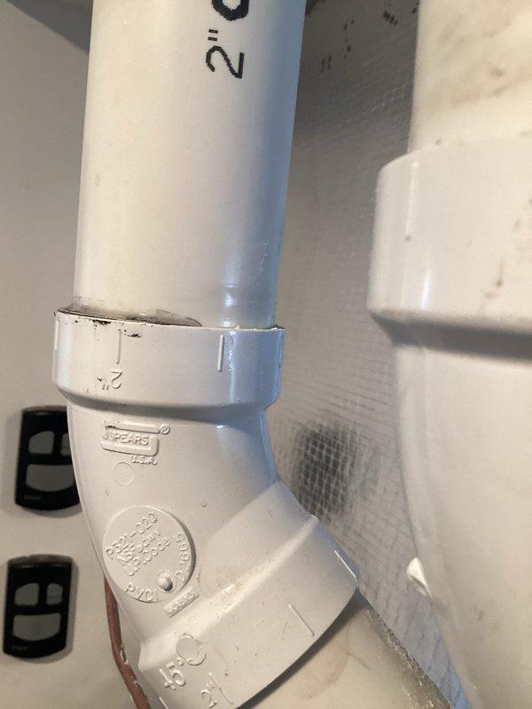 Responded to customer complaint of water dripping noise under master bathroom floor when furnace operates. Inspection revealed water damage in garage ceiling around PVC pipe connections to furnace. Identified condensation forming on cold PVC drain pipes during furnace operation as the source of the leak. Applied proper insulation to exposed PVC pipes to prevent further condensation and water damage.