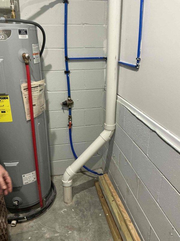 Conducted a comprehensive assessment for whole house water treatment system installation. Inspected existing plumbing configuration including water heater connections, PEX supply lines, and PVC drainage system in utility room. Evaluated available space and current infrastructure to determine optimal positioning for proposed water filter and softener units.