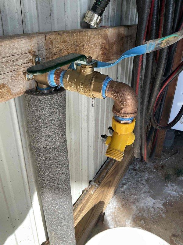 Responded to warranty service for a slow water leak at brass fitting installation. Inspected the brass shutoff valve assembly with copper elbow connection where approximately 4-5 gallons of water had leaked from the sealed connection. Applied appropriate sealing measures to resolve the dripping issue at the brass fitting connection point.