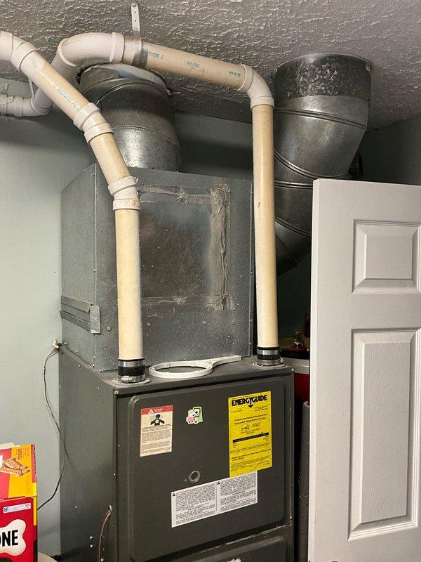 Performed comprehensive evaluation of aging HVAC system requiring replacement. Inspected outdoor condensing units showing significant wear and exposure to weather elements, with one unit actively experiencing condensation issues. Interior assessment revealed outdated furnace with inefficient components and existing ductwork that would require modification during system replacement. Customer requested full system replacement within one-week timeframe.