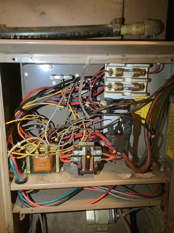 Diagnosed furnace that was continuously heating and overheating without proper cycling. Inspected wiring connections in control panel, which showed signs of disorganization and aging that could be contributing to the system's inability to shut off properly. Made necessary adjustments to restore proper thermostat control and heating cycle functionality.