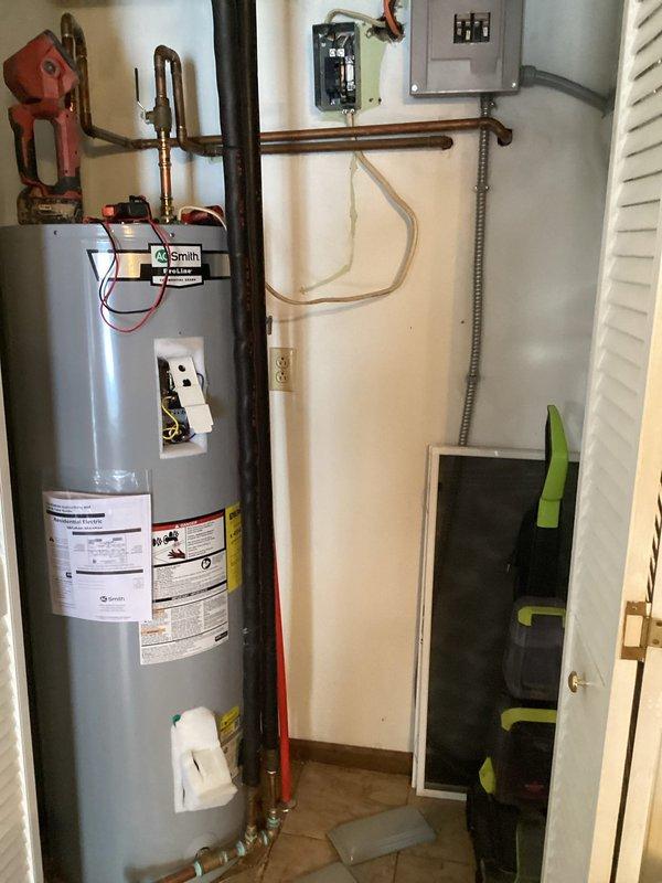 Responded to service callback for non-functioning water heater. Upon inspection, found circuit breaker for A.O. Smith water heater had tripped. Reset breaker and tested unit for proper operation, confirming water heater returned to normal functionality.
