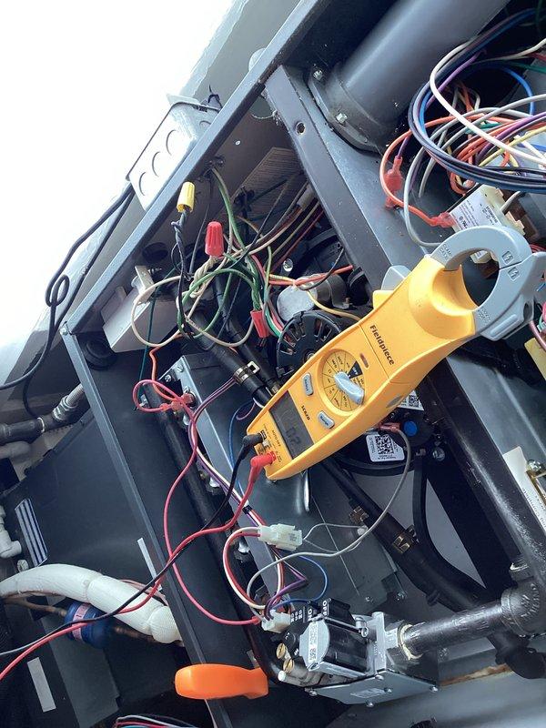 Performed CCH Basic Monthly maintenance service including filter replacement. Conducted comprehensive electrical diagnostic testing using clamp meter to verify proper system voltage and connections. Checked thermostat functionality, confirming proper temperature display (67°) and control operation.