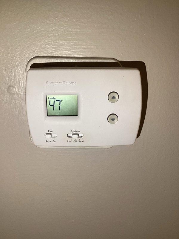 Responded to no heat complaint where indoor temperature had dropped to 47°F. Inspected Tempstar furnace in utility closet and found faulty thermostat settings. Reconfigured thermostat from "Cool" to "Heat" mode and verified system operation until proper heating was restored.