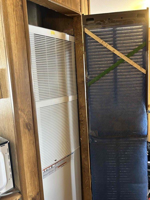 Performed mobile home furnace replacement, installing new indoor unit only. Removed heavily soiled air filter with significant dust buildup and replaced with clean filter. Took all three roof jack sizes for proper installation compatibility.