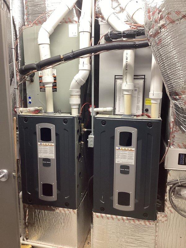 Responded to service call regarding non-functioning dampers. Accessed attic to inspect HVAC system, which consists of dual furnace units with extensive PVC ventilation network. Verified thermostat functionality (Honeywell Home digital display showing proper temperature and humidity readings). Trip fee waived per office authorization.