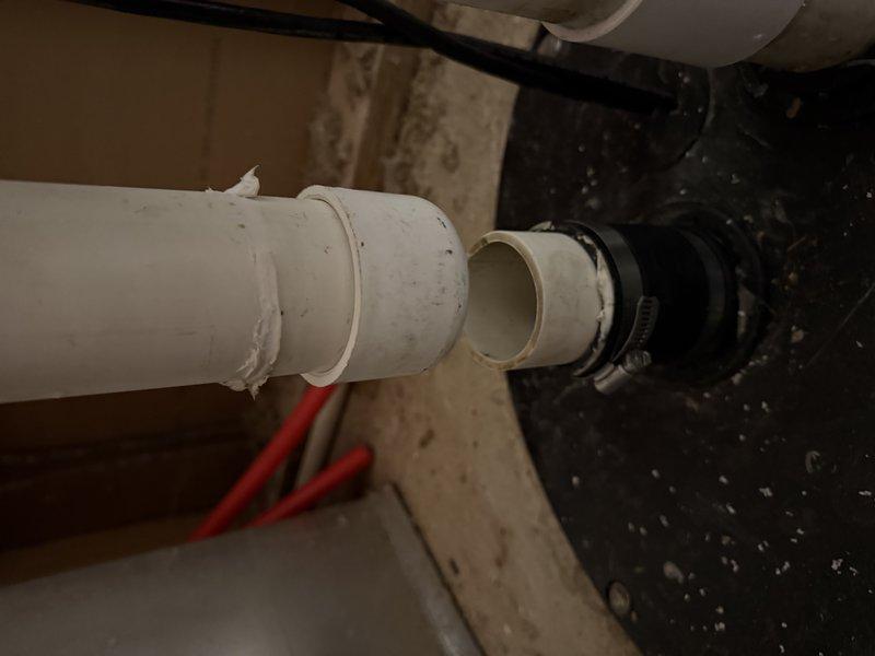 Conducted smoke test to evaluate pipe system for leaks. Identified separation in PVC pipe joint with visible gap at the rubber coupling. Inspection of confined utility chase area revealed additional plumbing infrastructure requiring attention.