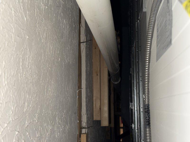 Conducted smoke test to evaluate pipe system for leaks. Identified separation in PVC pipe joint with visible gap at the rubber coupling. Inspection of confined utility chase area revealed additional plumbing infrastructure requiring attention.