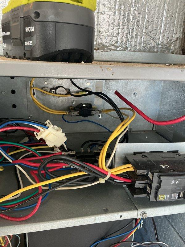 Performed rescheduled basic monthly heating maintenance on CCHP system. Inspected electrical connections and wiring in control panel, ensuring proper terminal connections and wire routing. Checked outdoor condenser unit, noting normal weathering but functioning properly despite snow accumulation around base.