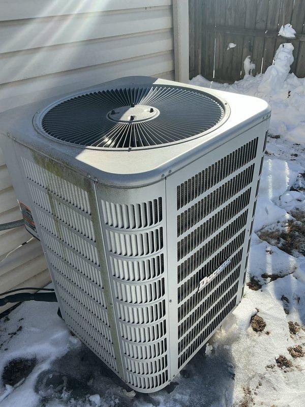 Performed rescheduled basic monthly heating maintenance on CCHP system. Inspected electrical connections and wiring in control panel, ensuring proper terminal connections and wire routing. Checked outdoor condenser unit, noting normal weathering but functioning properly despite snow accumulation around base.