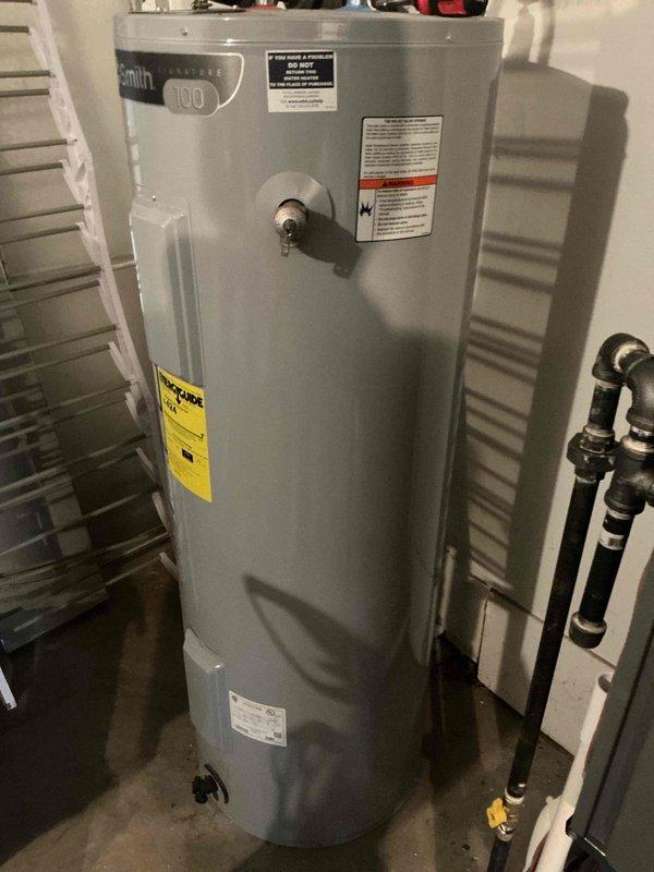 Performed monthly basic maintenance service on heating system. Inspected A.O. Smith Model 100 water heater for proper operation. Unit appears to be in good working condition with no visible leaks, damage, or corrosion noted during inspection.
