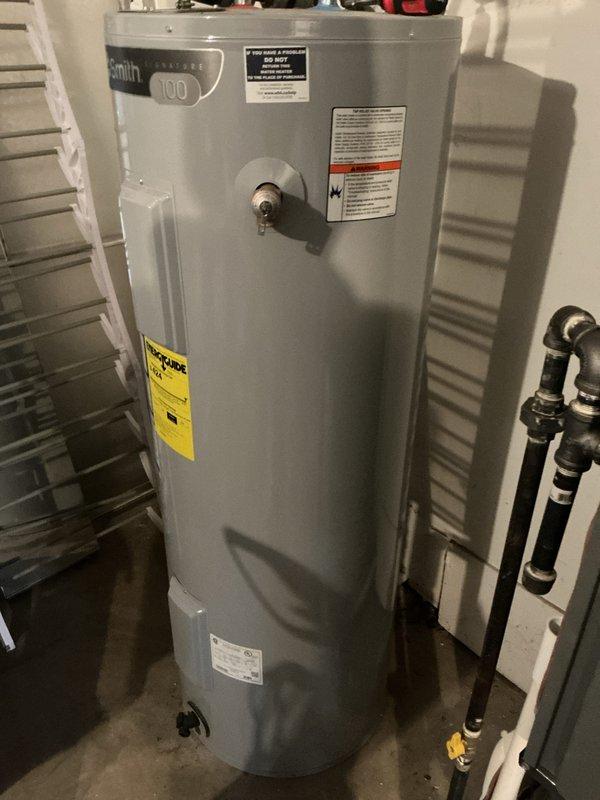 Performed monthly basic maintenance service on heating system. Inspected A.O. Smith Model 100 water heater for proper operation. Unit appears to be in good working condition with no visible leaks, damage, or corrosion noted during inspection.