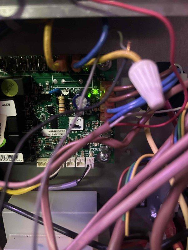 Diagnosed non-functioning hydro floor heating system. Inspected circuit board with illuminated LED and verified connections to wiring harness. Examined insulated piping components and associated copper lines within the system to identify the source of malfunction.