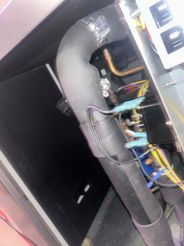 Diagnosed non-functioning hydro floor heating system. Inspected circuit board with illuminated LED and verified connections to wiring harness. Examined insulated piping components and associated copper lines within the system to identify the source of malfunction.
