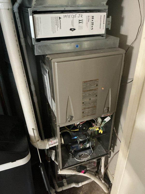 Performed comprehensive heating maintenance on customer's HVAC system. Inspected blower motor assembly, verified all electrical connections were secure with proper wire nuts, and examined filter housing components. System functionality confirmed with all components operating within normal parameters.