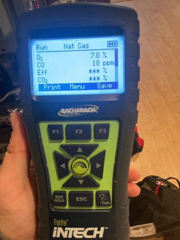 Performed annual heating maintenance service on CCH system. Checked thermostat operation which was correctly maintaining setpoint at 71° while heating to 75°. Combustion analysis with Bacharach Fyrite INTECH showed proper operation with 7.0% natural gas and CO levels at safe 18 ppm. System functioning normally with no issues detected.