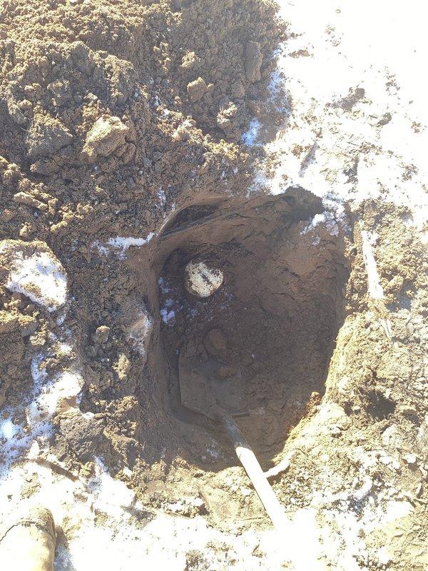 Performed excavation to access blocked drainage pipe. Attempted to clear significant blockage in sewer line without success. Discovered potential gas line issue requiring immediate follow-up service and notification to gas company for emergency assessment.