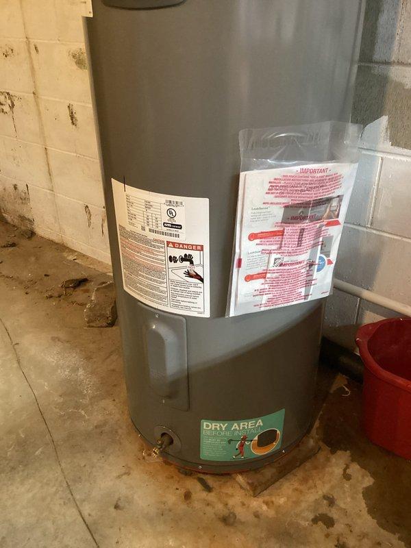 Responded to service call for water heater leaking from pressure relief valve. Inspected unit and found evidence of valve corrosion. Replaced temperature and pressure relief valve to resolve the dripping issue. Unit now functioning properly with no leaks observed.