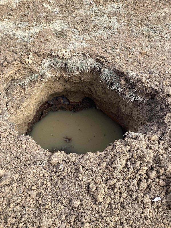 Responded to service call regarding sewer line issues. Replaced 35 feet of damaged sewer line; however, inspection revealed additional collapsed section at the end of the replacement area. Excavation exposed standing water indicating proper drainage is compromised. Further inspection and possible extension of line replacement recommended to address the complete blockage.