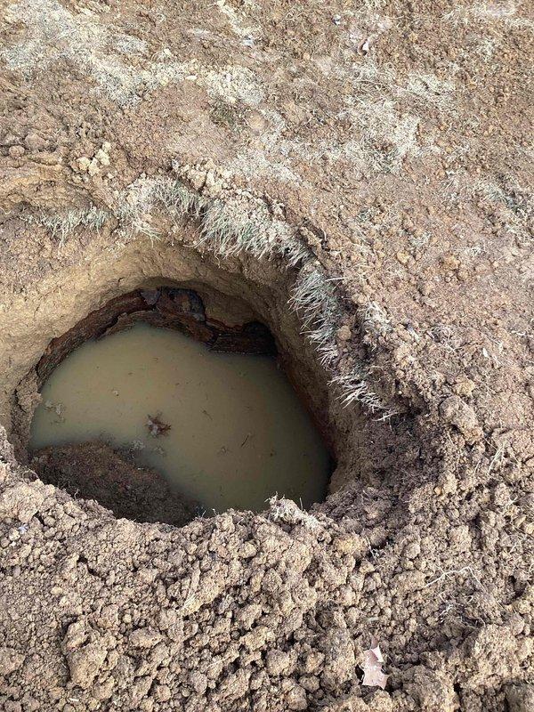 Responded to service call regarding sewer line issues. Replaced 35 feet of damaged sewer line; however, inspection revealed additional collapsed section at the end of the replacement area. Excavation exposed standing water indicating proper drainage is compromised. Further inspection and possible extension of line replacement recommended to address the complete blockage.