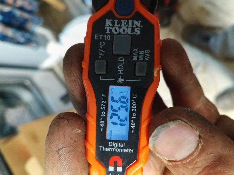 Successfully installed a complete Lennox AC and gas furnace system at the client's residence. Positioned the Lennox condenser unit on a properly prepared gravel base alongside the building's exterior wall, ensuring proper clearance and accessibility. System startup verified optimal performance with discharge temperature reading 119.3°F as measured with Klein Tools digital thermometer.