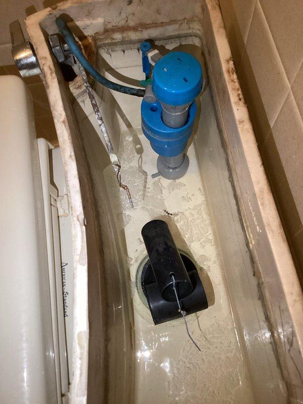 Responded to a water leak complaint where water was coming through the ceiling from an upstairs bathroom. Upon inspection, identified a faulty fill valve and worn flapper assembly in the toilet tank causing continuous water seepage. Replaced the toilet flange, installed new fill valve and flapper mechanism, and verified proper water shut-off function to resolve the leak issue.
