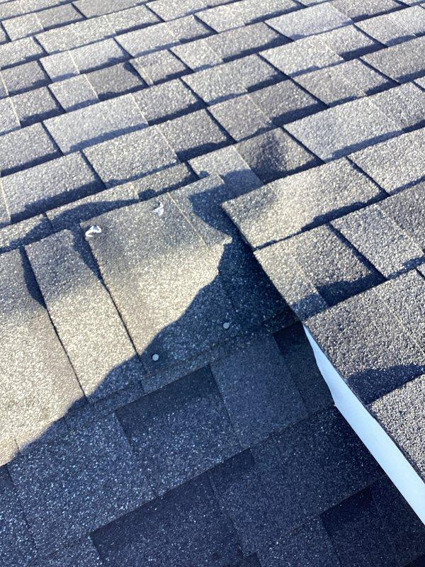 Performed inspection of customer's furnace and attic heating issues. Discovered inadequate insulation around the HVAC unit in attic, which was causing excessive heat accumulation. Documented roof damage with photographs, noting several damaged shingles that may be contributing to overall heating efficiency problems in the home.