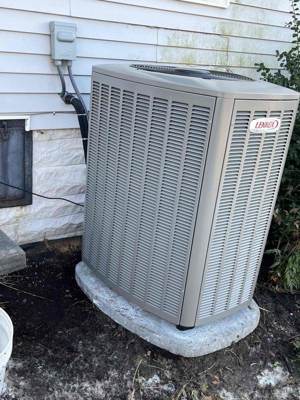 Completed installation of a complete Lennox HVAC system, including outdoor AC unit and gas furnace. System was properly mounted on concrete pad with electrical connections secured. Verified proper system pressure readings using UEI EM201B meter, with documentation of -17.34 In-Wg measurement during commissioning.