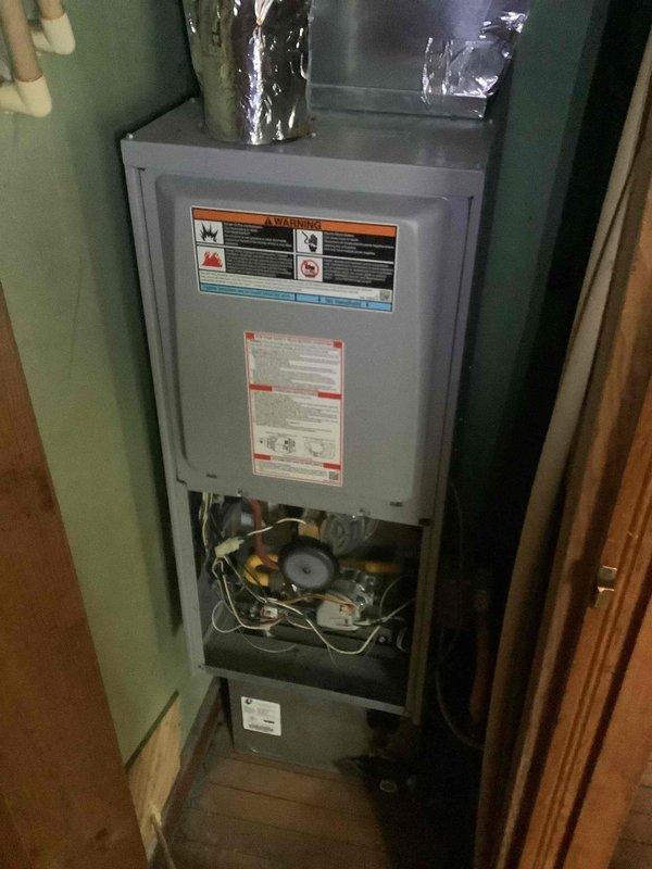 Diagnosed HVAC system issue by inspecting Honeywell ProSeries thermostat and furnace unit. Found system operating at 62 degrees, below setpoint, with all furnace components appearing in normal working condition upon visual inspection of internal components, wiring, motor and ductwork connections.