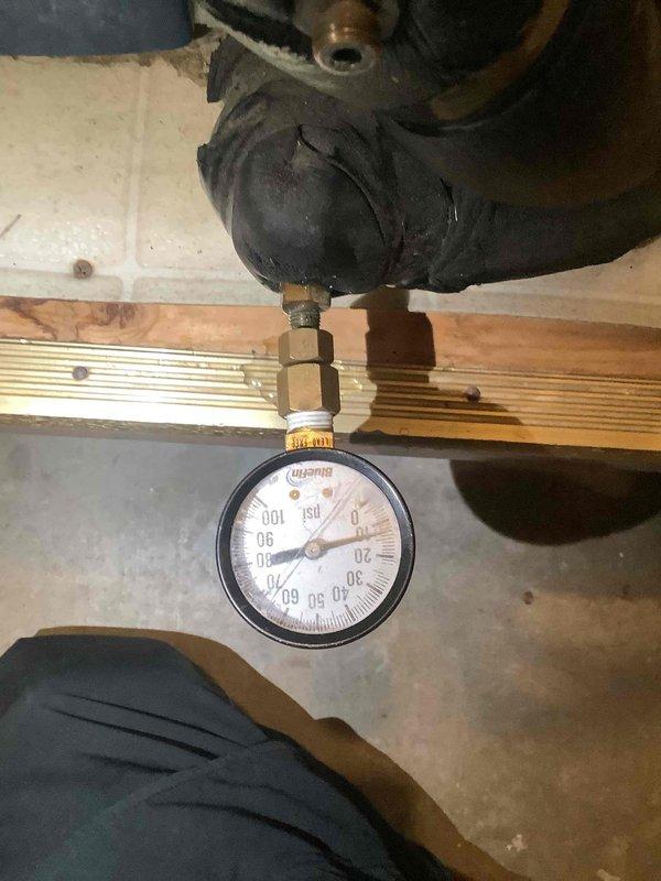 Performed system diagnostics on furnace with focus on pressure readings. Installed pressure gauge to assess system operation, with readings observed at approximately 30 PSI. Visual inspection of piping showed signs of aging and possible corrosion on cast iron components.