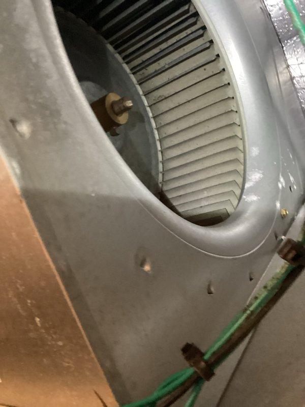 Performed monthly maintenance on heating system including inspection of blower wheel assembly which showed normal dust accumulation but remains in functional condition. Cleaned and reinstalled washable filter as per maintenance protocol. Inspected exterior condenser unit which is properly mounted on platform with electrical connections intact.