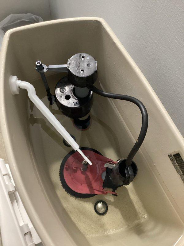 Responded to a service call regarding unusually high water usage (51,000 gallons previous month, 27,000 gallons current month). Upon inspection, detected a faulty toilet flapper valve causing continuous water leakage. Examined internal tank components, noted mineral buildup, and identified this as the source of the significant water consumption spike reported by customer.