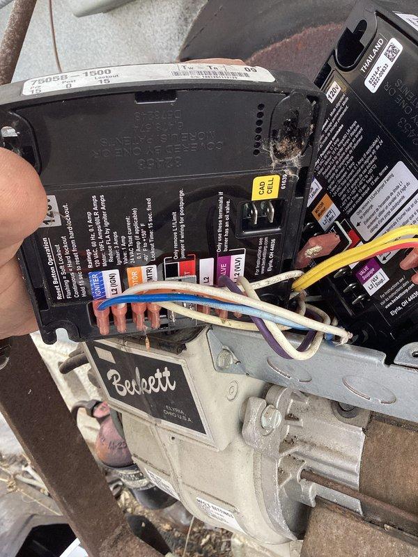 Returned to service oil furnace with malfunctioning control board. Removed and replaced defective Beckett control module that was showing signs of corrosion and connection issues. Completed testing of the new control board, verified proper wire connections (white, blue, yellow, and pink terminals), and confirmed normal system operation.