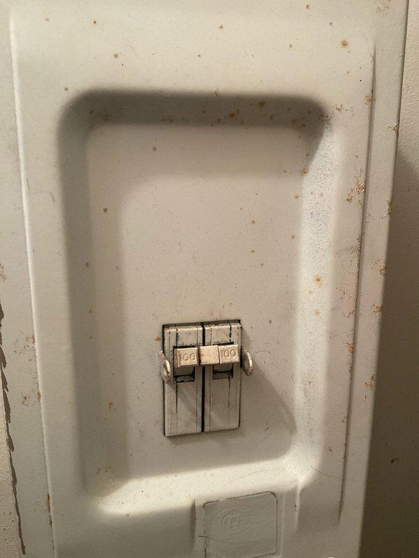 Conducted full system replacement estimate for a 1996 heat pump electric furnace system. Customer has been utilizing auxiliary electric heat exclusively for an extended period due to non-functional heat pump. Inspection revealed aging electrical panel with two 100-amp breakers showing signs of deterioration and exterior drainage system with corrugated flexible tubing running through foundation rock bed.