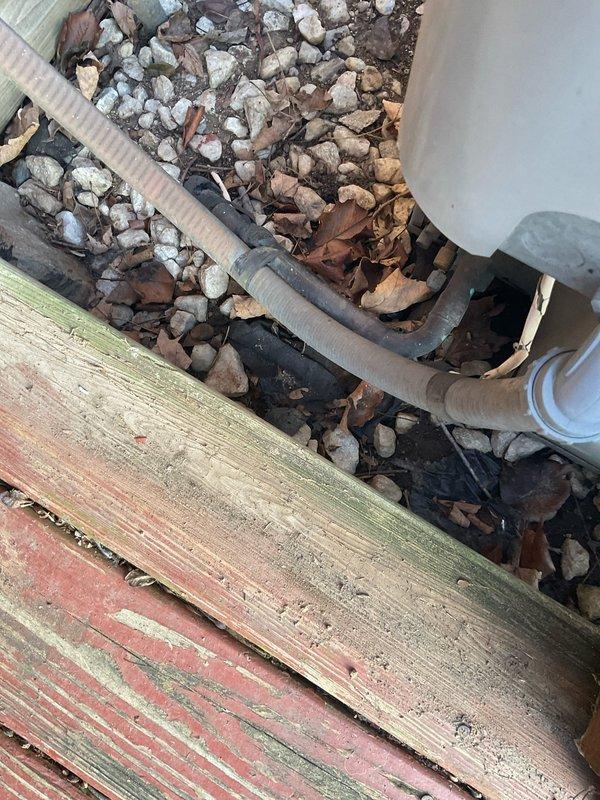 Conducted full system replacement estimate for a 1996 heat pump electric furnace system. Customer has been utilizing auxiliary electric heat exclusively for an extended period due to non-functional heat pump. Inspection revealed aging electrical panel with two 100-amp breakers showing signs of deterioration and exterior drainage system with corrugated flexible tubing running through foundation rock bed.