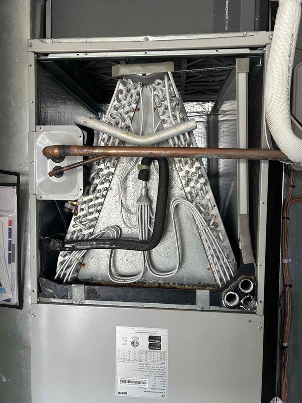 Returned to replace evaporator coil under manufacturer warranty on Bosch HVAC system. Documented lineset position and condition prior to replacement. Installed new coil and verified proper operation of system after completion.