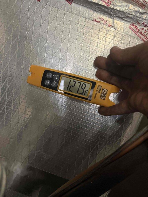 Installed new Lennox 80% efficiency furnace in residential utility closet, connecting to existing ductwork with proper 90-degree elbow joints and ensuring proper airflow direction. Temperature verification testing confirmed optimal system operation with readings of 127.9°F at heat exchanger output.