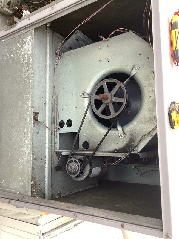 Diagnosed non-heating issue with Carrier furnace by inspecting the blower assembly and control board. Found significant dust accumulation on circuit board connections and belt wear on blower pulley system; cleaned electrical connections and adjusted belt tension to restore proper heating function.