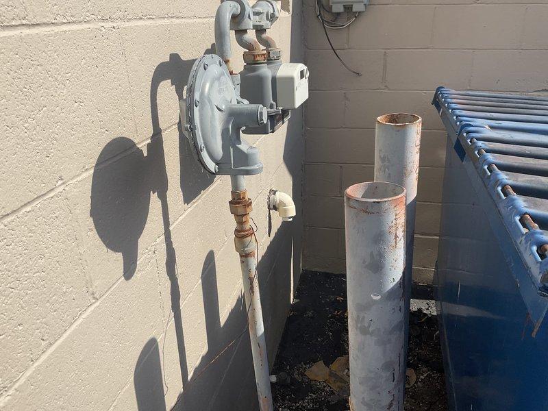 Completed site evaluation for mini split installation in commercial business space. Inspected existing electrical panel for available capacity and assessed current gas meter configuration to determine compatibility with proposed HVAC system. Photos documented current infrastructure to support detailed estimate preparation.