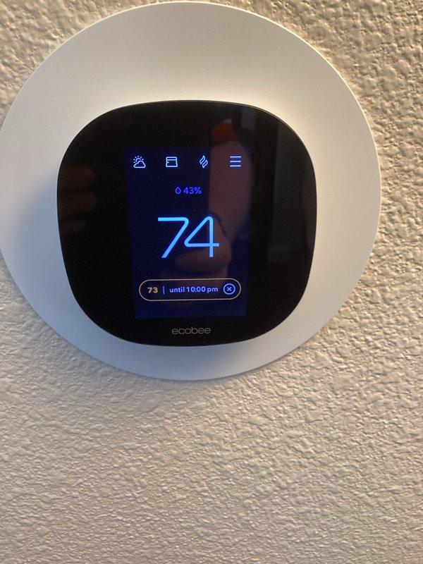 Responded to service call regarding excessive moisture concerns in home. Inspected intelligent dehumidifier system which was actively running at 30% relative humidity setting with ambient temperature reading 71°F. Verified proper operation of ecobee thermostat showing 74°F with 43% humidity level.