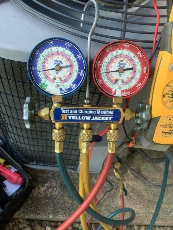 Performed routine heat maintenance on Heatmaster unit. Connected manifold gauge set to check refrigerant pressures and system operation. System is functioning properly with pressures within normal range. Customer's maintenance agreement renewed through 6/12/26.