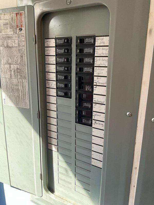 Performed on-site evaluation for potential installation of secondary AC unit in bay area, focusing on a heat pump system with gas backup. Existing heating unit was previously disabled due to compromised heat exchanger. Documented electrical infrastructure, including main breaker panel and adjacent electrical panel, to assess power capacity for proposed HVAC installation.