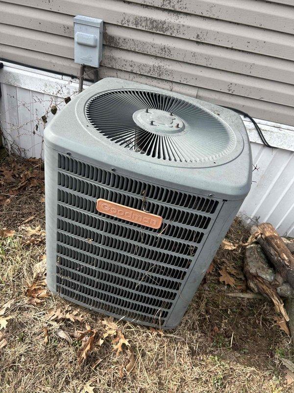 Diagnosed Goodman AC unit that was starting briefly then blowing hot air due to a refrigerant leak at the filter drier. Observed significant oxidation on copper lines and corrosion around system components. Replaced filter drier, performed leak repair, and recharged system to restore proper cooling operation.