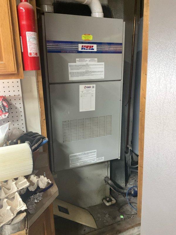 Conducted comprehensive system evaluation for full HVAC replacement. Inspected existing equipment including weathered exterior AC unit mounted against brick wall and Heil furnace in utility closet. Prepared detailed replacement estimate for complete system upgrade with customer requesting installation within one week timeframe.