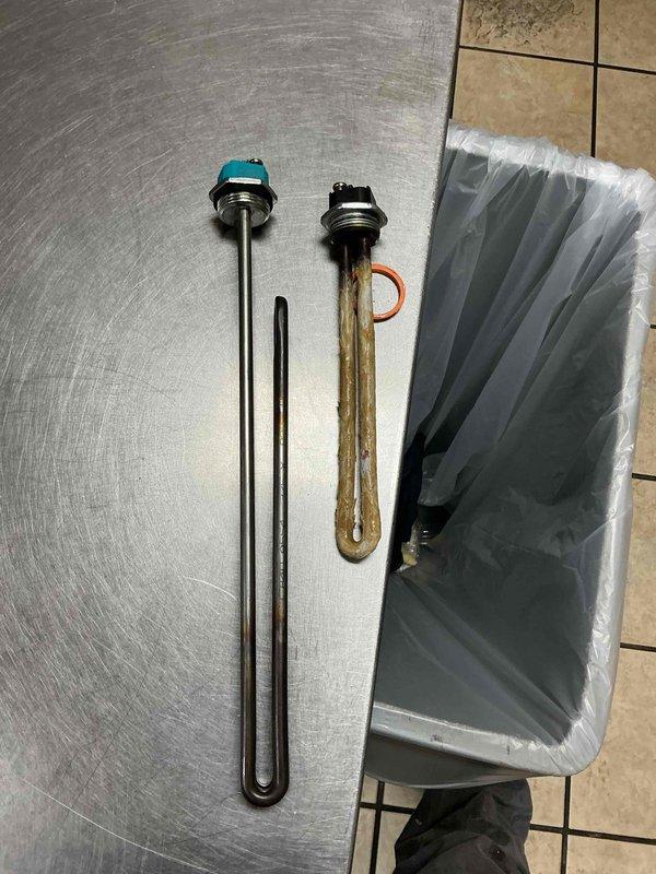 Diagnosed commercial water heater with no hot water issue. Inspection revealed corroded heating element, which was removed and replaced with new element including gasket. Tested system after installation to confirm proper operation and restoration of hot water supply.