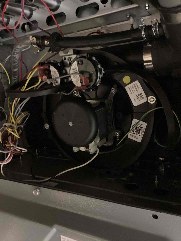 Diagnosed failed inducer motor in HVAC system and identified replacement part requirements. Documented system condition with photos of interior components including heat exchangers, blower assembly, and control boards. Will return with inducer motor (Johnstone Supply #241101784-001) to complete repair.