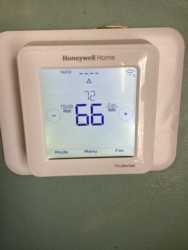 Responded to callback for system blowing cold air despite previous gas pressure adjustment. Diagnostic testing revealed gas pressure had drifted to 2.3 (below optimal range). Recalibrated thermostat and verified proper heat operation, confirming system now maintaining 72°F setpoint with "Heat On" status displaying correctly.