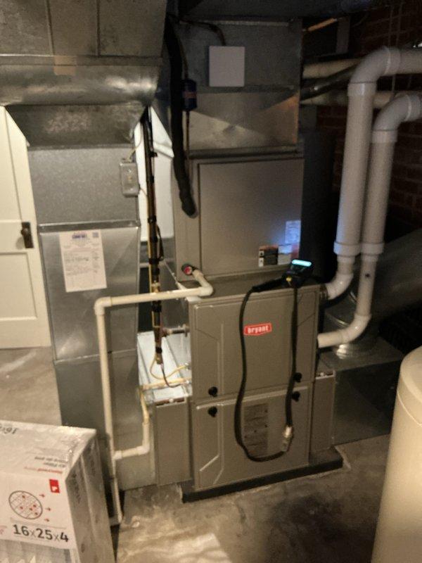 Performed comprehensive heating tune-up on Bryant furnace system located in utility room. Inspected all components including control wiring, ductwork connections, and PVC condensate lines. Also noted water heater in good working condition with proper plumbing connections. All systems functioning normally with no issues detected.